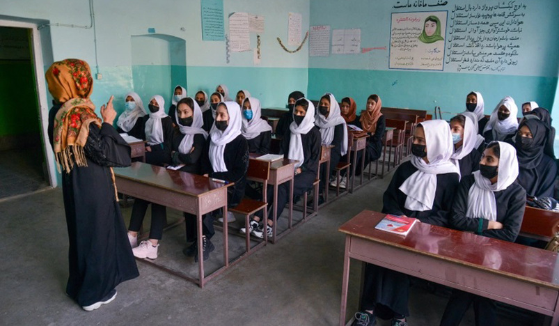 Girls attend a class after their school reopening in Kabul